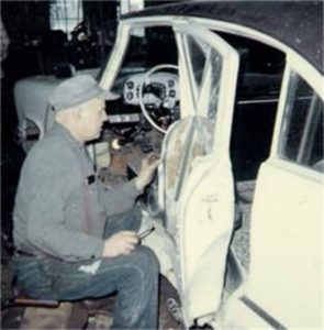 Bill Schaumburg repairing a wrecked car